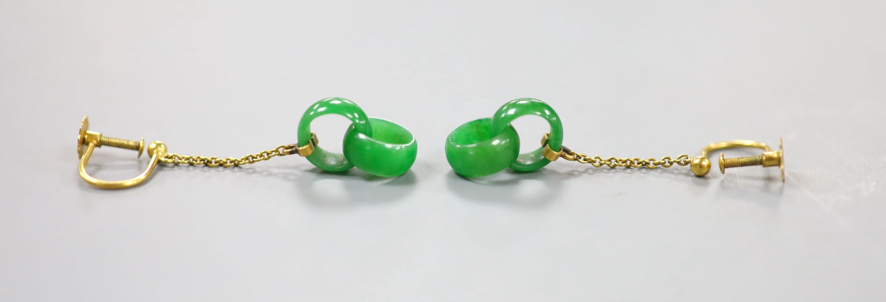 A pair of early to mid 20th century 9c yellow metal and jade double loop drop ear clips, drop 27mm, gross weight 1.8 grams.